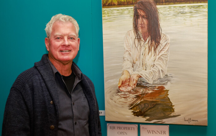 Lew Brennan with 2026 Open winning artwork The awakening.
